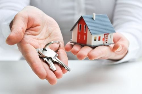 house in left hand keys in right hand