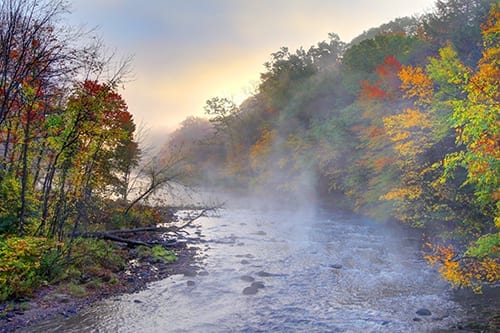 Autumn foliage on Millers River along the Mohawk Trail in Massachusetts. The Mohawk Trail Region is a great western Massachusetts Vacation spot and features outdoor activities, gift shops, great restaurants, arts and cultural events
