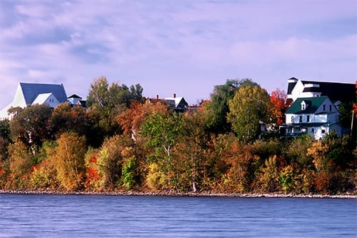 The St. John River flows past Woodstock New Brunswick on an Autumn morning