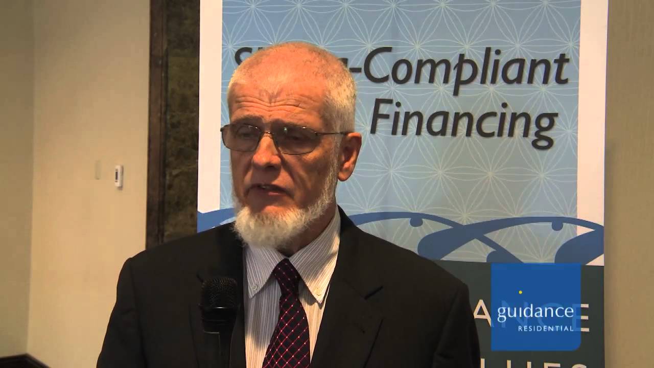 man with glasses speaking