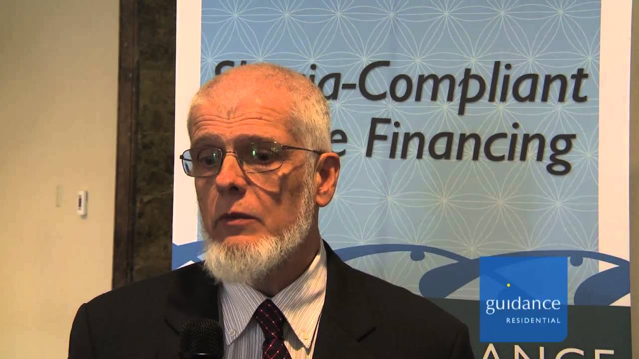 man with glasses speaking